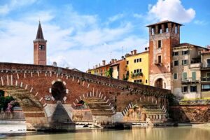 view of the ponte pietra over the adige river in verona italy